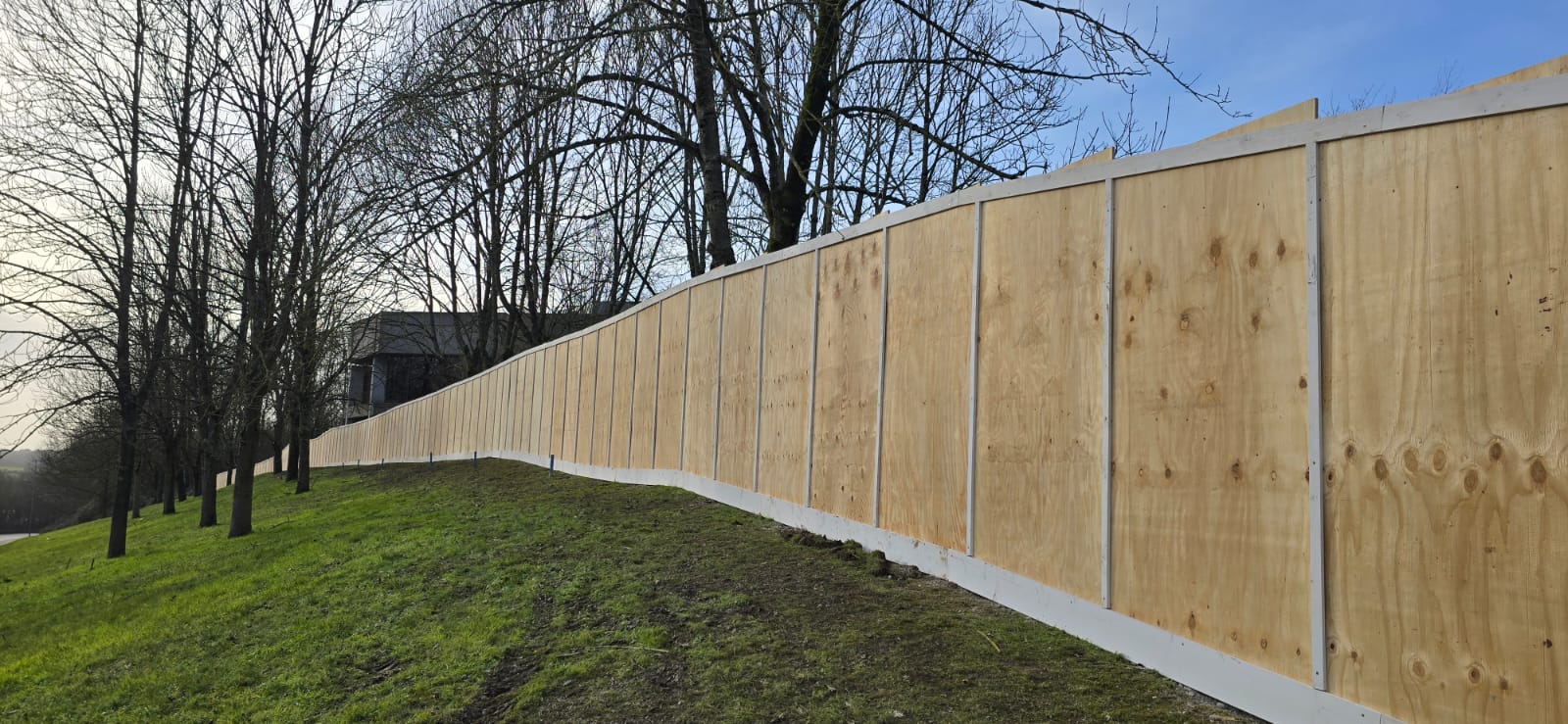 Timber hoarding installation - construction site security fencing UK